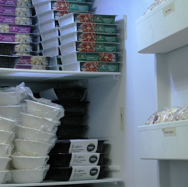 WCK meals stacked into an upright freezer