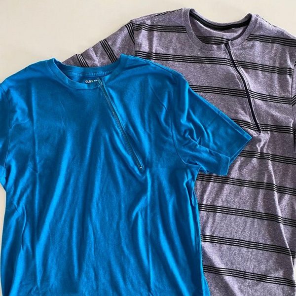 A chemotherapy child port shirt in blue and another in grey from west coast kids cancer foundation