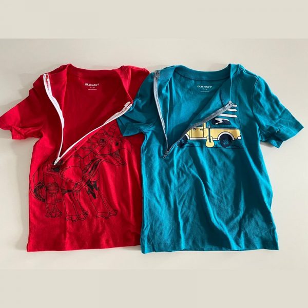 An open chemotherapy child port shirt in blue and another in red from west coast kids cancer foundation