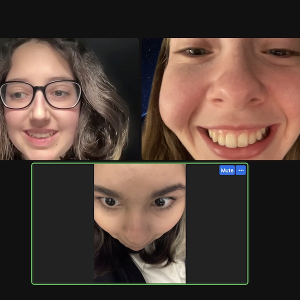 A screenshot of three youth participants joining in with an online Hangout. They are all smiling.