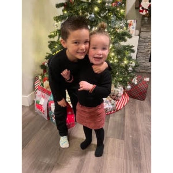 Sofia and Carter in front of Christmas Tree