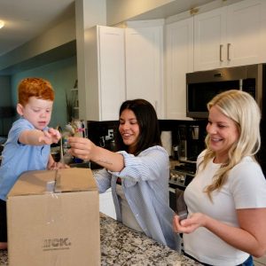A WCK box full of meals being opened by Megan and her family
