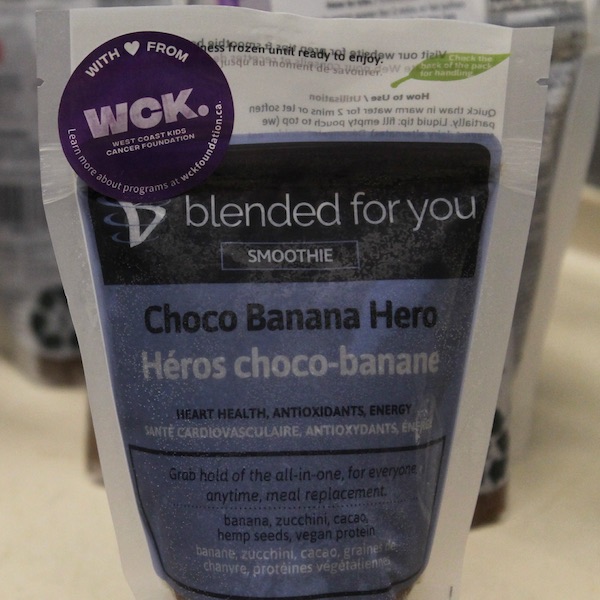 A Blended For You chocolate and banana frozen smoothie with a WCK sticker on it
