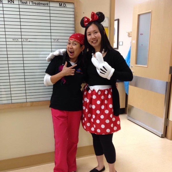Celina with a colleague at BC Children's Hospital, both dressed up. Celina is dressed up as Minnie Mouse.