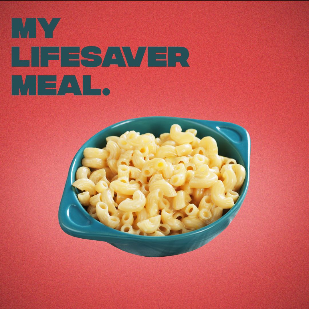 A bowl of mac and cheese on a red background. Text above it says "My lifesaver meal."